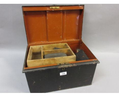 Small tin trunk containing a quantity of carved wooden printing blocks