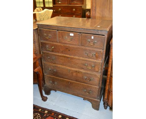 18th Century oak secretaire chest, the moulded top above four simulated drawers enclosing a fitted interior, above three long