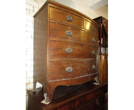 19th Century mahogany bow front chest of two short and three long drawers with oval brass handles and bracket feet (at fault)