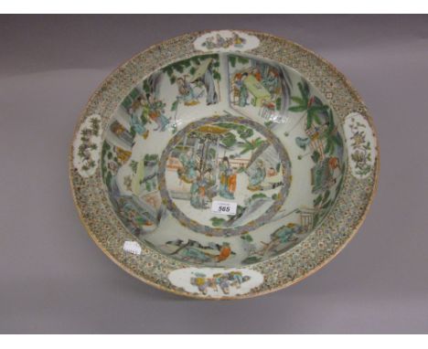 Chinese famille verte basin decorated with panels of figures in interior and garden scenes, 16.5ins diameter (with riveted ha