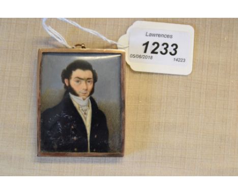 19th Century watercolour, portrait miniature on ivory of a gentleman wearing a navy blue coat, waistcoat, stock and tie-pin i
