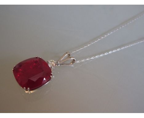 Large 18ct white gold pendant set treated cushion cut ruby on an 18ct white gold chain