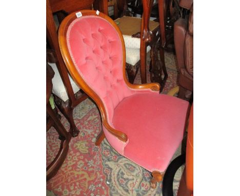 Pink button upholstered low seat nursing chair in Victorian style