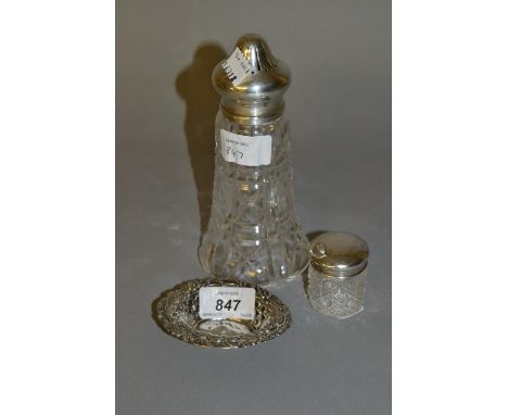 Oval silver trinket dish, silver mounted cut glass sugar caster and a silver mounted cut glass dressing table bottle