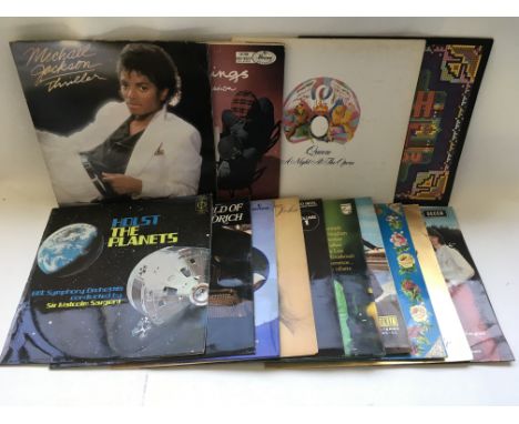 A collection of 7 inch singles and LPs by various artists including Queen, Michael Jackson and others.