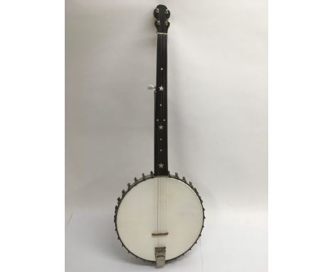 A banjo with mother of pearl Star and dot inlays to fretboard.