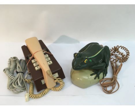 A vintage Trimphone and a novelty frog phone
