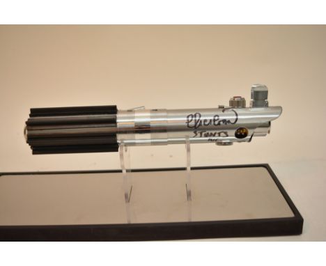 An extremely rare Luke Skywalker Episode IV A New Hope original Graflex lightsaber with COA and signed by Norman Harrison and