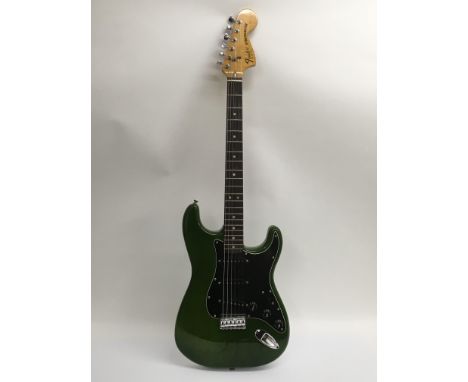 A 1979 USA Fender Stratocaster in green with a black scratchplate. The guitar has a maple neck with a rosewood fingerboard, l