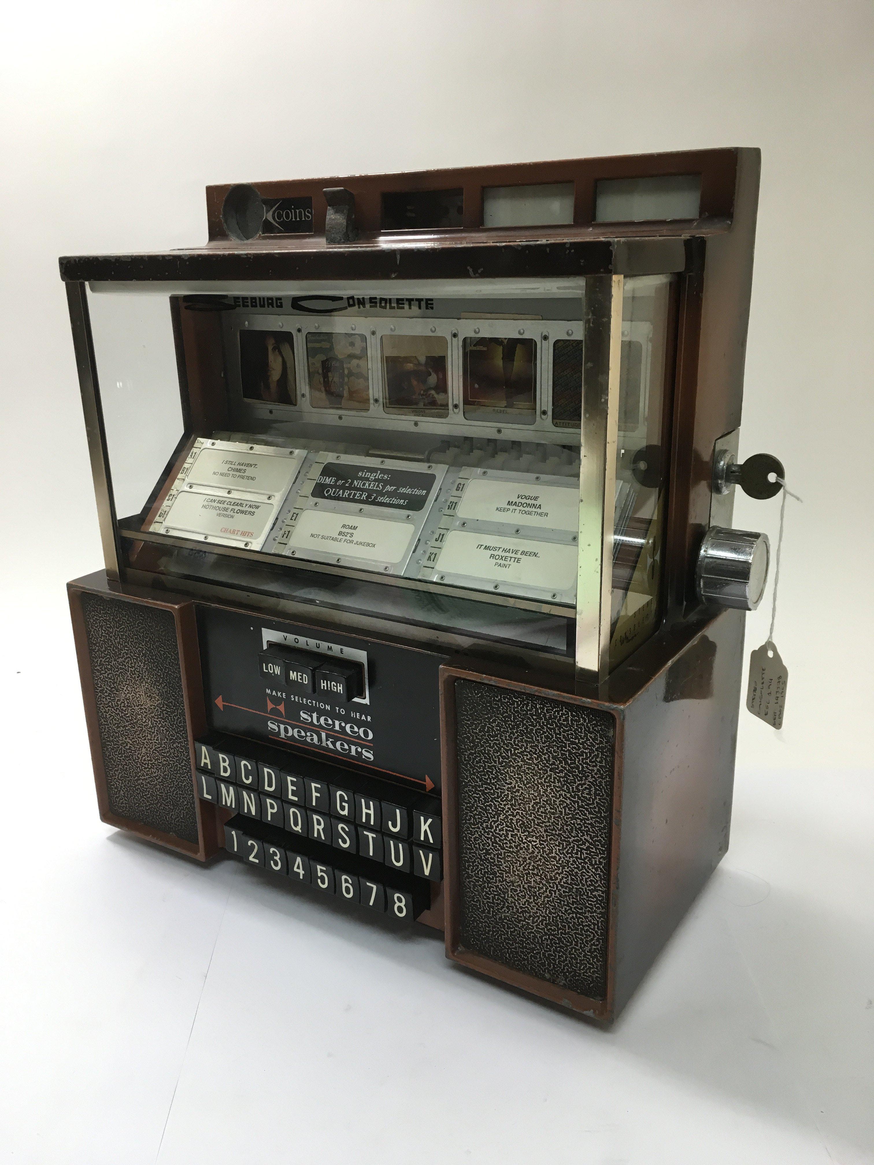A Seeburg Consolette table top jukebox, model ESC194 circa early to mid