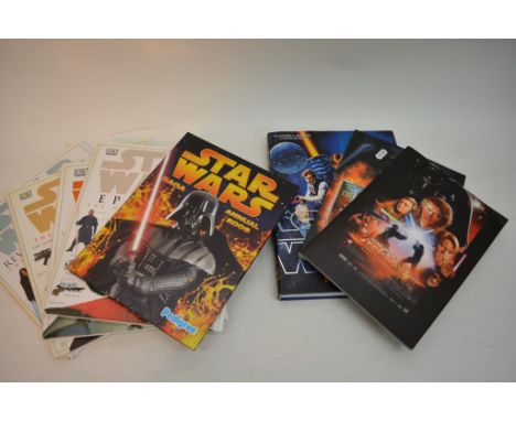 A collection of Star Wars books including The Star Wars Chronicles for the prequels, Incredible Cross Sections, Visual Dictio