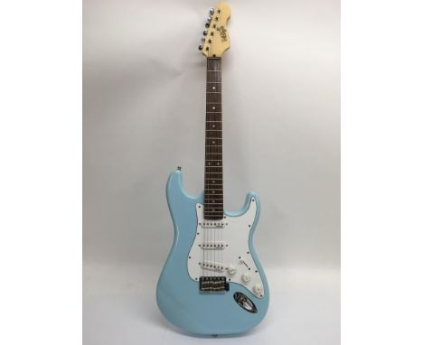 A Vintage Trevor Wilkinson Stratocaster copy guitar in sonic blue with white scratchplate, supplied with soft carry case.