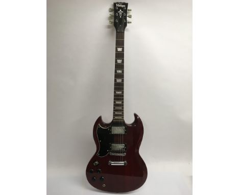 A left handed Vintage SG copy electric guitar in red with a black scratch plate, supplied with a soft carry case.