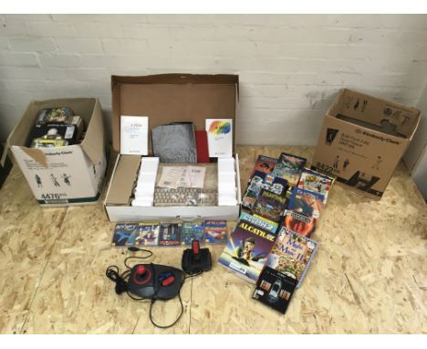 A vintage boxed Commodore Amiga 500 plus joysticks and a quantity of various games