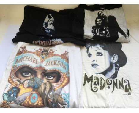 A collection of various tour t-shirts including Madonna, Michael Jackson, Debbie Harry and others.
