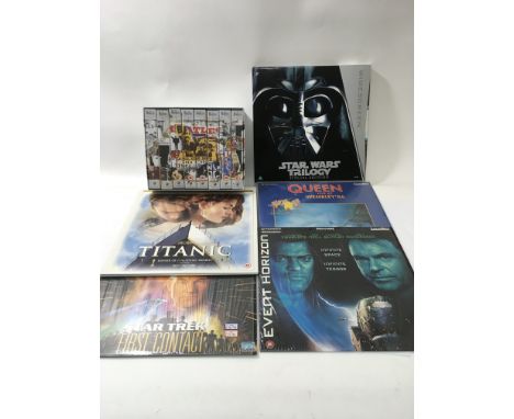 Five laser discs including a Star Wars trilogy special edition, three Walt Disney deluxe video box sets and a Beatles Antholo