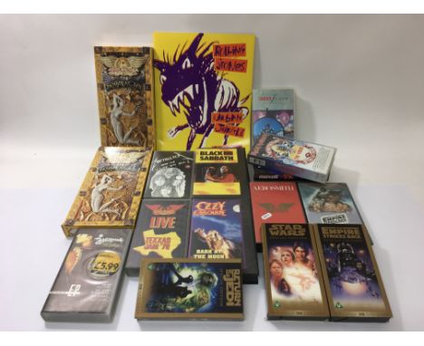 Two Aerosmith 'Pandora's Box' CD and cassette box sets, various music and film related videos plus a Rolling Stones 'Urban Ju