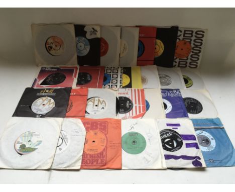 A box of 7 inch singles by various artists including Cat Stevens, Isaac Hayes, Buddy Holly and others.