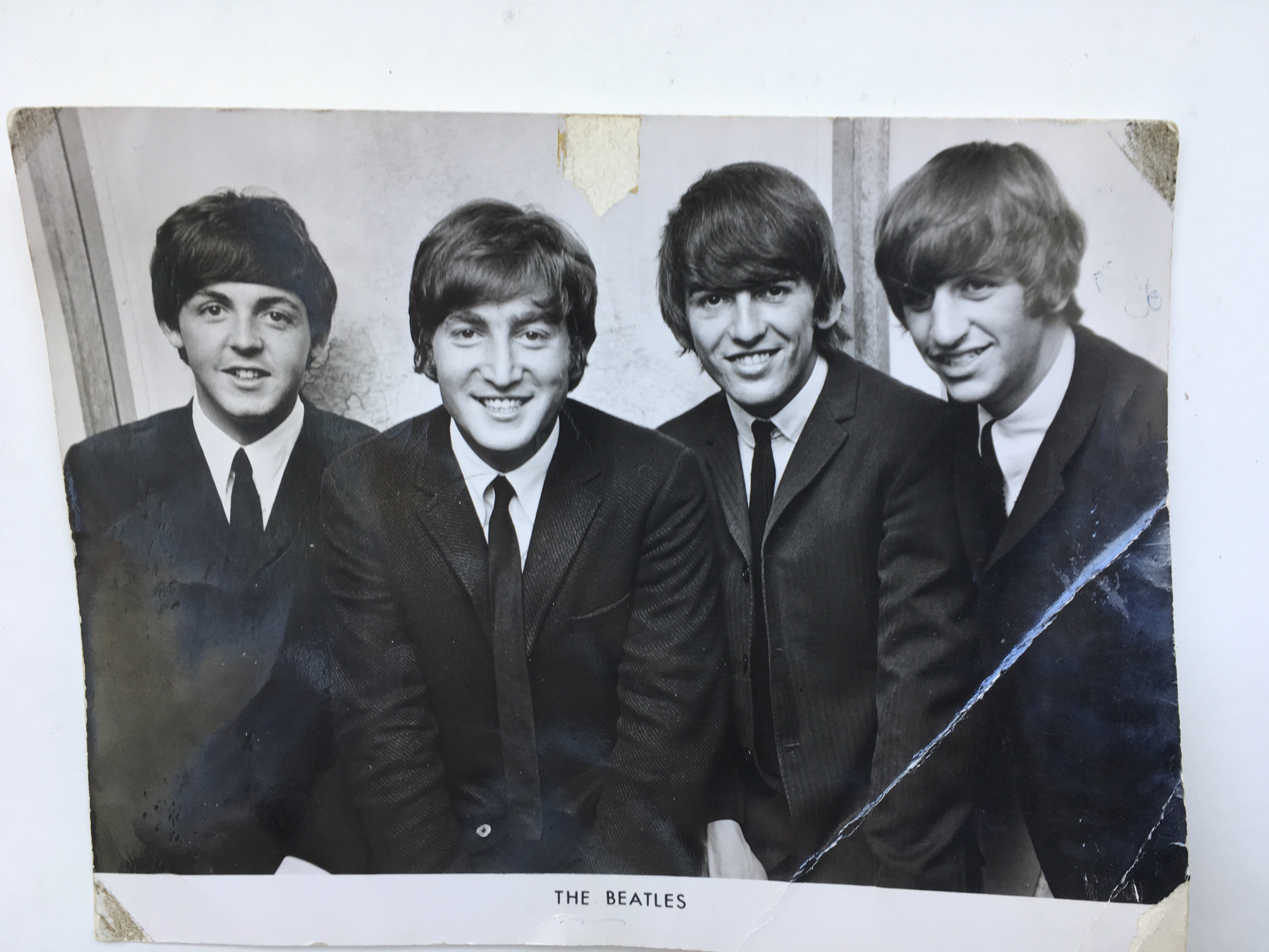 A circa 1964 black and white photograph of The Beatles signed to the ...