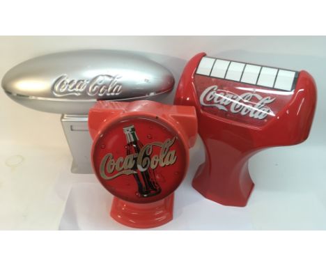Three plastic Coca Cola 'light up' advertising displays