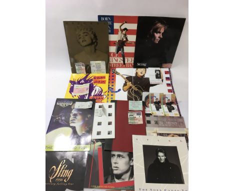 A collection of tour programs, tickets and t-shirts including Paul McCartney, The Rolling Stones, Bruce Springsteen and other