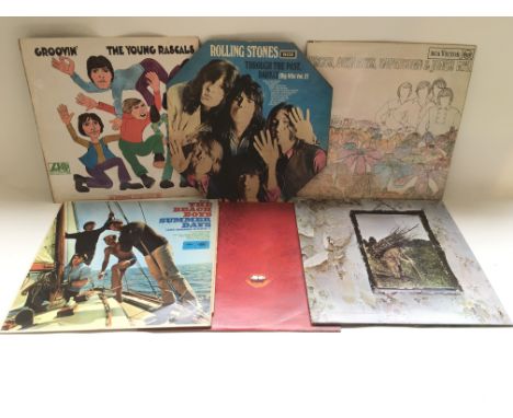 Thirteen LPs by various artists including The Rolling Stones, The Monkees, Led Zeppelin, The Moody Blues and others.