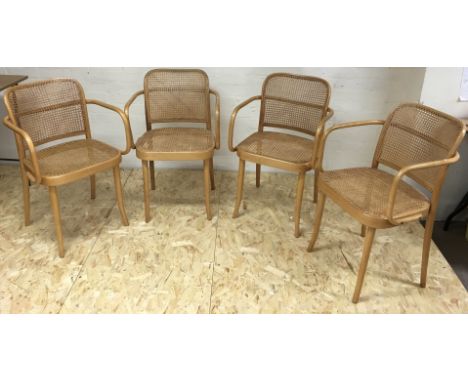 A set of four light wood bentwood type cane chairs