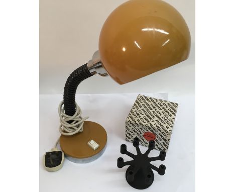 A adjustable desk lamp with yellow shade and a boxed Robert Welch modernist candle holder