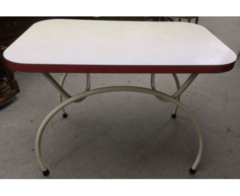 A vintage 1950's diner style table with Formica type top on curved tubular frame.Approximately 67x107x80cm high