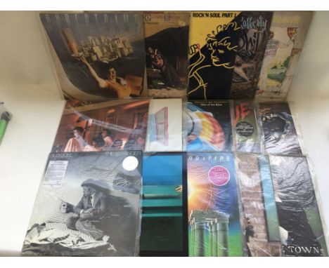 A collection of LPs by various artists including Elton John, Rod Stewart, Michael Jackson and others.