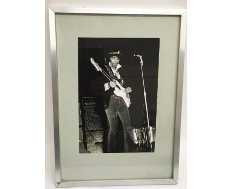A framed and glazed limited edition print of Jimi Hendrix, approx 30cm x 42cm.