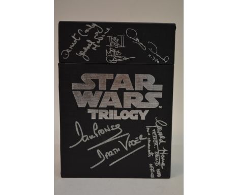 A Star Wars trilogy DVD box set signed by various actors including Dave Prowse, Caroline Blakiston, Paul Blake, Kenny Baker, 