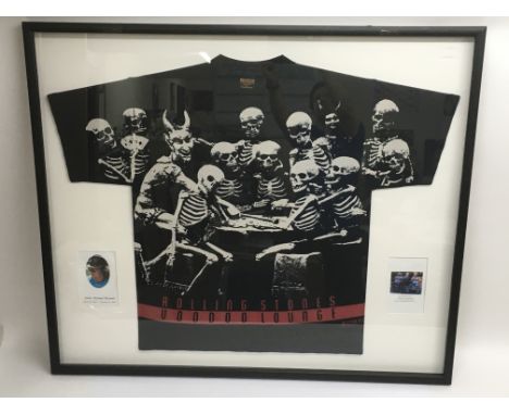 Three framed and glazed Rolling Stones t-shirts including two advertising 'Voodoo Lounge' and one for the 'Urban Jungle' 1990