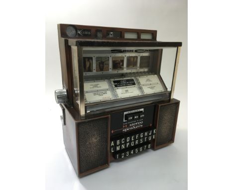 A Seeburg Consolette table top jukebox, model ESC194 circa early to mid 60's, complete with key and manual, approx 35cm x 39c