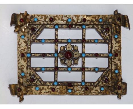 A 19thC Renaissance Revival gilt metal photo frame (?), decorated overall with enamel arabesque leaf scroll and set with ruby