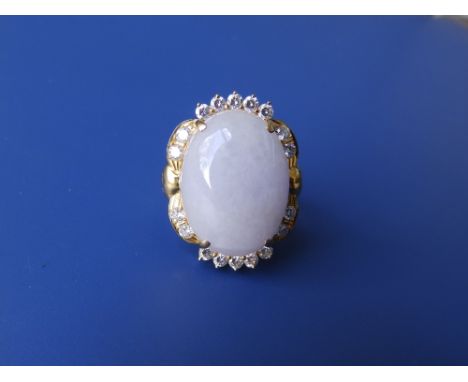A lavender jade &amp; diamond set cluster ring in '750' yellow metal.