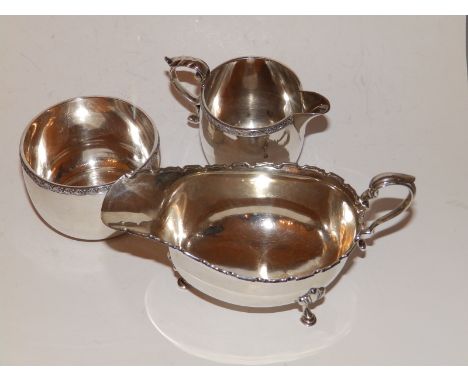 A small Sheffield silver cream jug and sugar basin - Sheffield 1927 and a Birmingham sauce boat. (3)