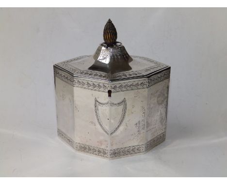 A neoclassical  octagonal silver tea caddy with pineapple finial,  bright cut borders and two vacant shields - CC, London 178