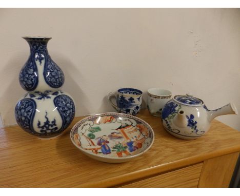 An Oriental blue &amp; white double gourd vase, 7" high, a Chinese porcelain saucer, two cups and a small Japanese teapot - a