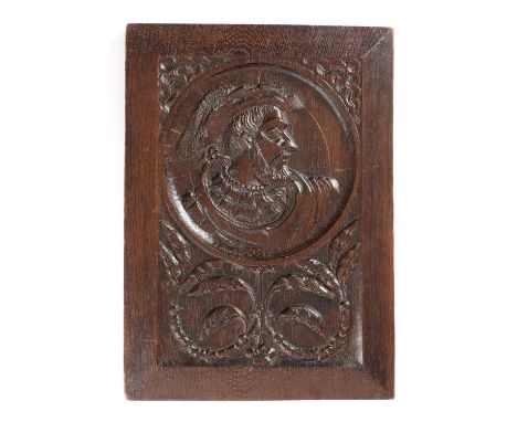 A TUDOR ROMAYNE TYPE OAK PORTRAIT PANELC.1530the profile portrait of a bearded man inside a sunburst rondel beneath foliate s