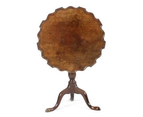 AN EARLY GEORGE III MAHOGANY TRIPOD OCCASIONAL TABLEC.1760-70the circular tilt-top with a moulded pie-crust edge, on a turned