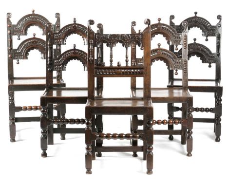 A HARLEQUIN SET OF FIVE CHARLES II OAK SIDE CHAIRSDERBYSHIRE, C.1680four with a twin arched back carved with stylised 'S' mot
