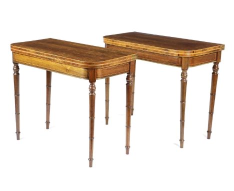 λ A PAIR OF GEORGE III ROSEWOOD CARD TABLESC.1800each with boxwood line inlay, enclosing a baize lined playing surface, on ta