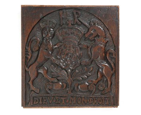 A JAMES I OAK PANEL OF THE ROYAL COAT OF ARMSC.1603decorated with the lion and unicorn flanking a crowned rosette and with cy