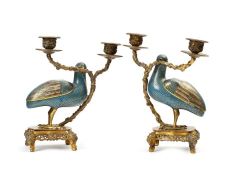 A PAIR OF CHINESE CLOISONNE AND GILT BRASS QUAIL CANDELABRAEARLY 20TH CENTURYeach modelled as a bird with a twin branch cande