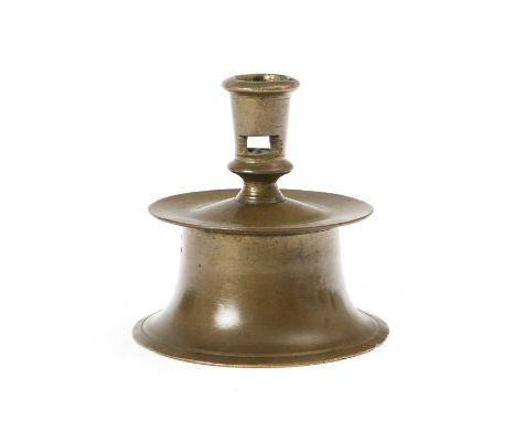 A BRASS CAPSTAN CANDLESTICKPOSSIBLY FLEMISH, LATE 16TH CENTURYthe slightly tapering socket with a pair of lateral rectangular
