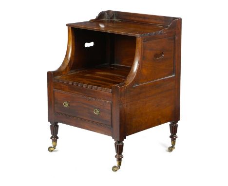 A GEORGE III MAHOGANY LANCASHIRE COMMODEIN THE MANNER OF GILLOWS, C.1800with a low gallery above a hinged shelf, on downswept