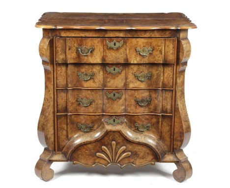 A DUTCH BURR WALNUT COMMODE 18TH CENTURYthe archer's bow moulded edge top above four long ripple moulded drawers, the lowest 
