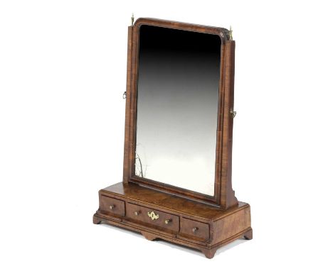 A GEORGE II WALNUT DRESSING TABLE MIRRORC.1735-40the rectangular plate on a box base with caddy moulding and fitted with thre