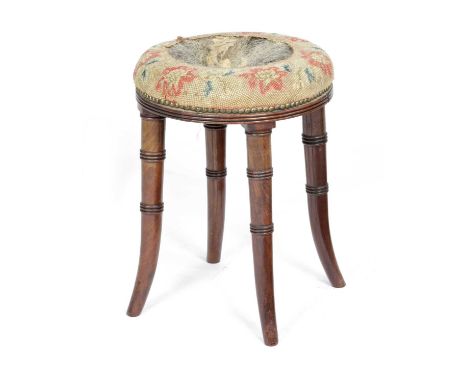 A REGENCY MAHOGANY STOOLATTRIBUTED TO GILLOWS, EARLY 19TH CENTURYthe circular seat with a partial needlework upholstery on ri